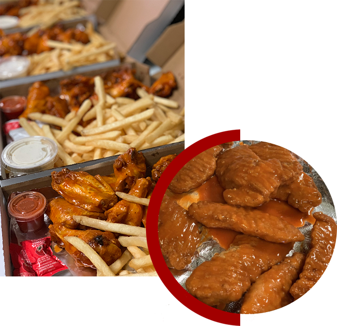 A close up of chicken wings and fries